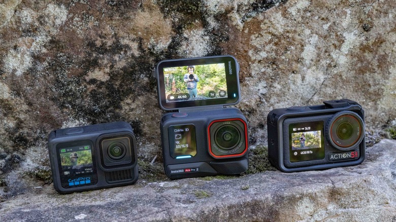 GoPro Hero 13 Black, Insta360 Ace Pro 2, and DJI Osmo Action 5 Pro on a stone ledge.