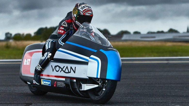 Professional rider driving a Voxan Wattman electric motorcycle