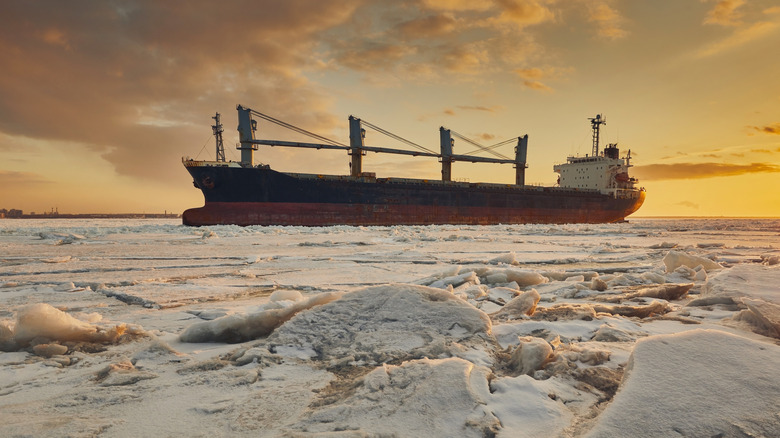 A nuclear-powered icebreaker sails across an Arctic landscape
