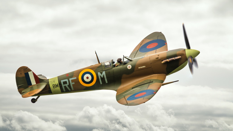 Supermarine Spitfire flying on cloudy sky